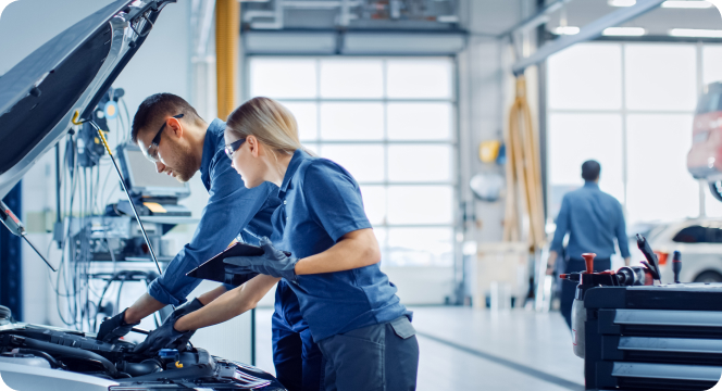 Mechanics working on a car