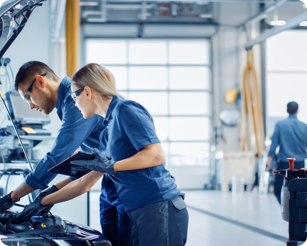 Mechanics working on a car